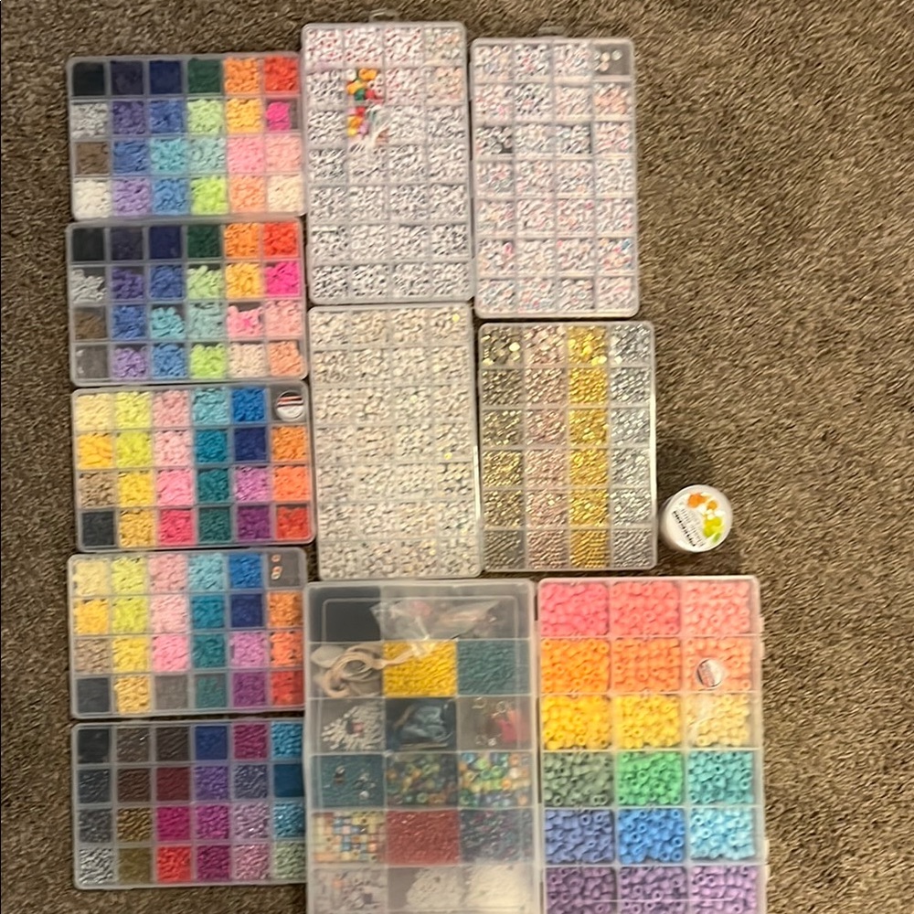 11 Bead organizers full of beads
